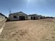 Exterior view of single Gathering homes under construction featuring scaffolding and unfinished roofing at 2356 E Spur Dr, San Tan Valley, AZ 85140