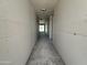 Hallway featuring smooth grey concrete flooring and grey unfinished walls at 2356 E Spur Dr, San Tan Valley, AZ 85140