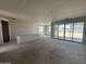View of the open living room, featuring grey concrete flooring and grey unfinished walls at 2356 E Spur Dr, San Tan Valley, AZ 85140