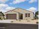 Charming single-story home with a two-car garage and desert landscaping in the front yard at 2370 E Spur Dr, San Tan Valley, AZ 85140