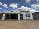Exterior view of a home under construction showing installed windows and wrapped insulation at 2370 E Spur Dr, San Tan Valley, AZ 85140