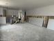 Unfinished living room area with concrete flooring and installed framing and electrical wiring at 2370 E Spur Dr, San Tan Valley, AZ 85140