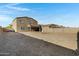 Large dirt backyard offers ample space for customization and entertainment, ready for your personal touch at 25457 W Clanton Ave, Buckeye, AZ 85326