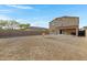 Expansive dirt backyard providing endless possibilities for landscaping and outdoor activities at 25457 W Clanton Ave, Buckeye, AZ 85326