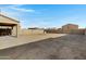 Huge dirt backyard, providing a canvas for creating the perfect outdoor living space and recreational area at 25457 W Clanton Ave, Buckeye, AZ 85326
