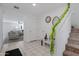 Bright foyer with tile flooring, white walls, and a staircase at 25457 W Clanton Ave, Buckeye, AZ 85326