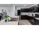 The kitchen features a large island, stainless steel appliances, and tile floors at 25457 W Clanton Ave, Buckeye, AZ 85326