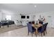 Inviting living room and dining area featuring lots of seating and natural light at 25457 W Clanton Ave, Buckeye, AZ 85326