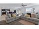 Open-concept living room with cozy seating and easy access to dining area at 25457 W Clanton Ave, Buckeye, AZ 85326
