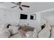 Comfortable living room featuring a ceiling fan and plush seating at 25457 W Clanton Ave, Buckeye, AZ 85326