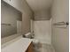 Bright bathroom featuring a shower-tub combo and neutral color palette at 2600 E La Costa Dr, Chandler, AZ 85249