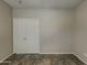 Spacious bedroom with double doors and neutral color palette at 2600 E La Costa Dr, Chandler, AZ 85249