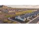 Expansive view of a community with golf course, desert landscaping and tile roof homes at 26673 W Ponderosa Ln, Buckeye, AZ 85396