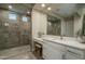 Modern bathroom with a spacious walk-in shower, double vanity, and stylish fixtures at 26673 W Ponderosa Ln, Buckeye, AZ 85396