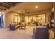 Expansive covered patio featuring comfortable seating, ceiling fan, and seamless access to the indoors at 26673 W Ponderosa Ln, Buckeye, AZ 85396