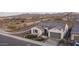 Beautiful desert home with a gray tile roof, landscaped yard, and mountain backdrop at 26673 W Ponderosa Ln, Buckeye, AZ 85396