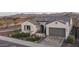 Charming home featuring a tile roof, desert landscaping, and mountain views at 26673 W Ponderosa Ln, Buckeye, AZ 85396