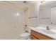 Bright bathroom with neutral walls features a shower/tub combo and a vanity at 3031 N Civic Center Plz # 112, Scottsdale, AZ 85251