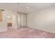 The bedroom has mirrored closet doors and an ensuite bathroom at 3031 N Civic Center Plz # 112, Scottsdale, AZ 85251