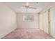 Spacious bedroom featuring a large window with a patio door and a ceiling fan at 3031 N Civic Center Plz # 112, Scottsdale, AZ 85251