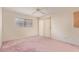 The spacious bedroom features a large window for natural light and a ceiling fan at 3031 N Civic Center Plz # 112, Scottsdale, AZ 85251