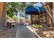 Entrance to the clubhouse with a covered awning, bench, and fountain at 3031 N Civic Center Plz # 112, Scottsdale, AZ 85251