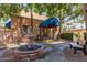 Entrance to the clubhouse with a covered awning, bench, and fountain at 3031 N Civic Center Plz # 112, Scottsdale, AZ 85251