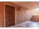 Exterior door entrance to condo with stone steps and wooden stairs leading to other units at 3031 N Civic Center Plz # 112, Scottsdale, AZ 85251
