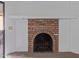 A classic brick fireplace with a white mantle creates a cozy focal point at 3031 N Civic Center Plz # 112, Scottsdale, AZ 85251