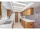 Functional kitchen features wood cabinets, laminate countertops, and standard appliances at 3031 N Civic Center Plz # 112, Scottsdale, AZ 85251