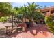 Outdoor grill and seating area with palm trees at 3031 N Civic Center Plz # 112, Scottsdale, AZ 85251