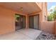 Covered patio with neutral stucco walls includes two sliding glass doors at 3031 N Civic Center Plz # 112, Scottsdale, AZ 85251