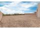 Undeveloped backyard space, offering potential for landscaping, outdoor entertaining, and personalized design at 33857 N Borgata Trl, San Tan Valley, AZ 85144