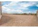 Spacious, undeveloped backyard with gravel ground cover, showcasing a blank canvas for outdoor living and landscaping at 33857 N Borgata Trl, San Tan Valley, AZ 85144