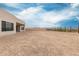 Expansive backyard featuring a gravel ground cover and a low-maintenance design, ready for customization and landscaping at 33857 N Borgata Trl, San Tan Valley, AZ 85144