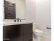 Modern bathroom featuring dark cabinets, quartz counters, and sleek fixtures at 33857 N Borgata Trl, San Tan Valley, AZ 85144