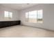 Bright bedroom with ample natural light from the large windows and dark cabinets at 33857 N Borgata Trl, San Tan Valley, AZ 85144