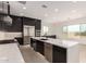 Spacious kitchen featuring stainless appliances and a large island at 33857 N Borgata Trl, San Tan Valley, AZ 85144