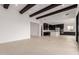 Open concept living area with views to the kitchen and access to the outdoors at 33857 N Borgata Trl, San Tan Valley, AZ 85144
