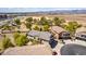 A spacious suburban home with a well-manicured lawn, and a three car garage at 343 N 169Th Ave, Goodyear, AZ 85338