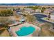 Aerial view showcasing a community pool with lounge chairs and covered areas, perfect for relaxation and recreation at 343 N 169Th Ave, Goodyear, AZ 85338
