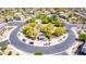 A community featuring a pool, clubhouse, and gathering area surrounded by tree-lined streets at 343 N 169Th Ave, Goodyear, AZ 85338