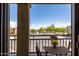 Charming balcony with seating area, offering serene outdoor space and neighborhood views at 343 N 169Th Ave, Goodyear, AZ 85338