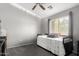 Comfortable bedroom features plush carpet, natural light, and a neutral color scheme at 343 N 169Th Ave, Goodyear, AZ 85338
