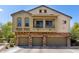 Inviting three-story townhome with a three-car garage and charming balcony, perfect for modern living at 343 N 169Th Ave, Goodyear, AZ 85338