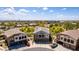 Stunning home with a three-car garage and a charming balcony, surrounded by lush landscaping at 343 N 169Th Ave, Goodyear, AZ 85338