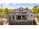 Two-story home showcasing a balcony and a three-car garage, featuring a blend of stucco and stone facade at 343 N 169Th Ave, Goodyear, AZ 85338