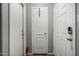Hallway with multiple doors, offering access to different areas of the house at 343 N 169Th Ave, Goodyear, AZ 85338