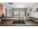 Modern kitchen with a dark sink, breakfast bar, and open view into the living room at 343 N 169Th Ave, Goodyear, AZ 85338