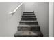 Carpeted stairs lead to the upper level of the house, providing a comfortable transition at 343 N 169Th Ave, Goodyear, AZ 85338